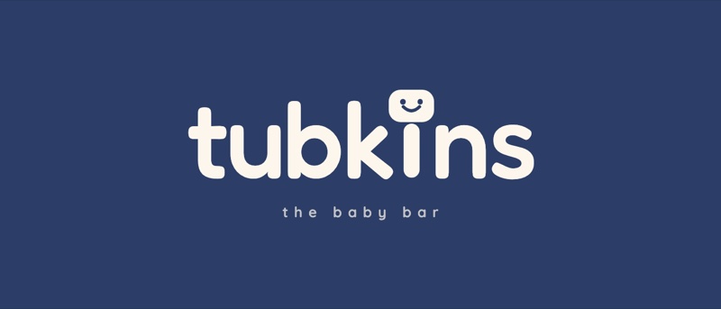 The Tubkins wordmark reversed in cream on navy.